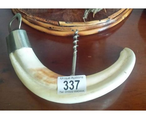 A horn corkscrew/bottle opener.