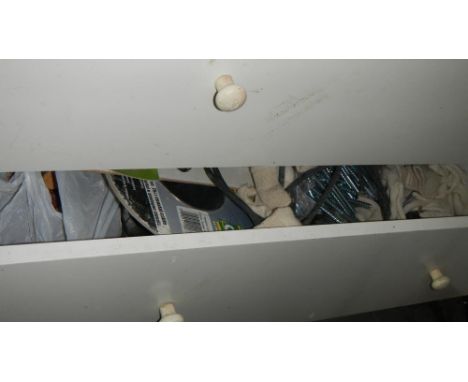 A white chest and a blue chest full of tools etc
