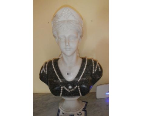 A large heavy marble bust of a lady.