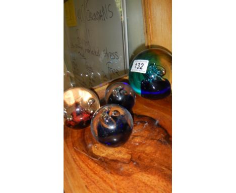 4 glass paperweights including Caithness and medicine bottles etc.,
