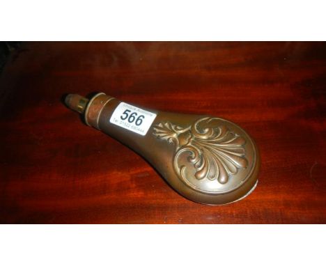 A copper gun powder flask.