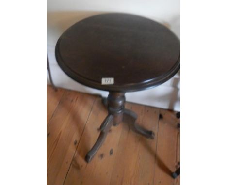 An oak tripod table.