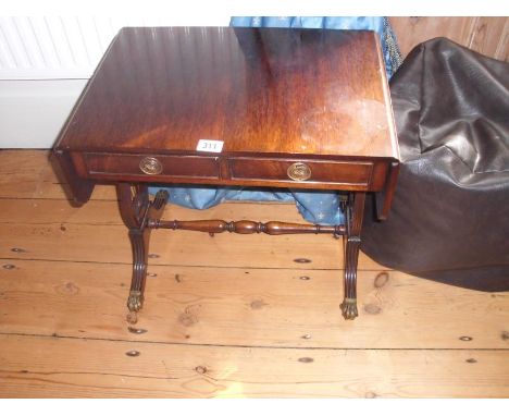 A small sofa table with Lyre sides