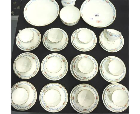 Minton tea service; a twelve place setting of cups, saucers and cake plates with milk jug, sugar bowl and two plates, one cak