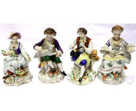 Sitzendorf; four ceramic seated figures, two holding lambs, H: 13 cm. Some minor losses to petals. P&amp;P Group 3 (£25+VAT f