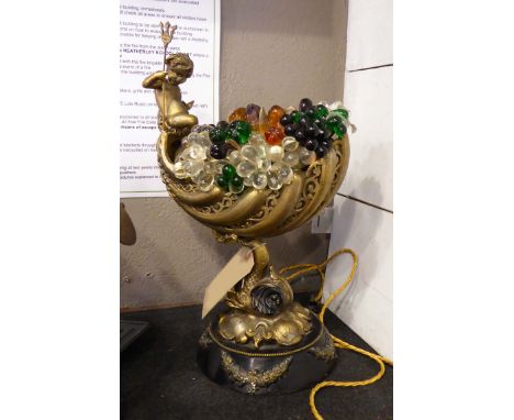 TABLE LAMP, vintage gilt and ebonised metal shell overflowing with coloured glass fruit and flowers surmounted by a triton wi