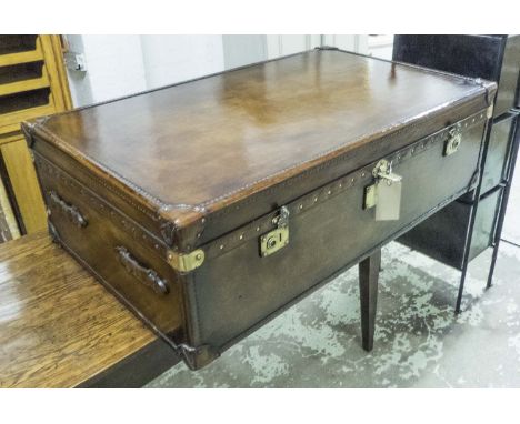 LOW TRUNK, brown leather with a rising lid, a polished brass detail stamped Bond Street, London, 40cm H x 129cm x 78cm.