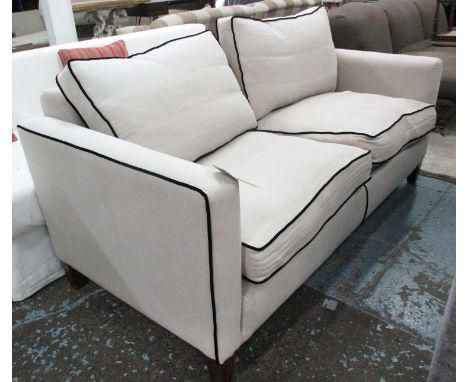 SOFA, two seater in neutral fabric with black piping to edges on square supports, 182cm L.