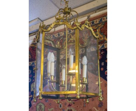 HALL LANTERN, Louis XVI design, brass of hexagonal form with glass panels and six lights, 79cm H x 49cm W excluding chain.