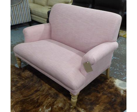 SOFAS & STUFF SOFA, two seater, of small proportions with pink upholstery on short turned front supports with brass cappings 
