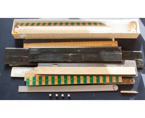 A quantity of rules, including three articulating ebonised parallels and a roller model 