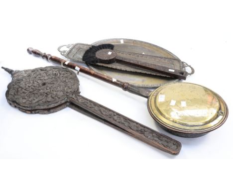 A Black Forest carved bellows and fire brush including bed pan and two brass trays (5)