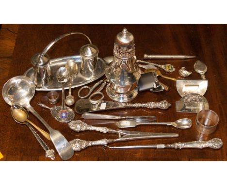 Filled silver glove stretcher handles, manicure tweezers, etc, together with EPNS castor, ladle, etc parcel lot  