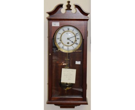 A Woodford eight day Vienna style wall clock, with white dial and three winder holes