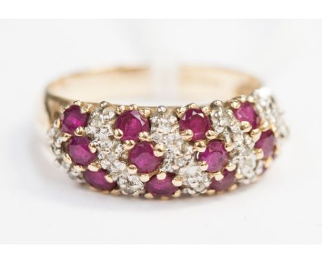 A 9ct gold ruby and diamond chip dress ring 