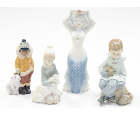 A Lladro Eskimo with bear cub, matte finish and two high gloss Lladro figures with a Nao boy and rabbit (4)