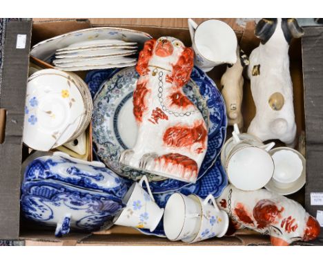 A quantity of assorted ceramics to include a Burslem blue and white tureen, a pair of red Staffordshire dogs, an Art Deco sty