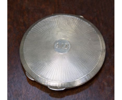 A silver powder compact, engine turned 
