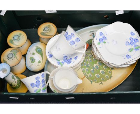 A Colclough Art Deco part tea service, nineteen pieces and and Edwardian/1920s peacock design six piece dressing table set (1