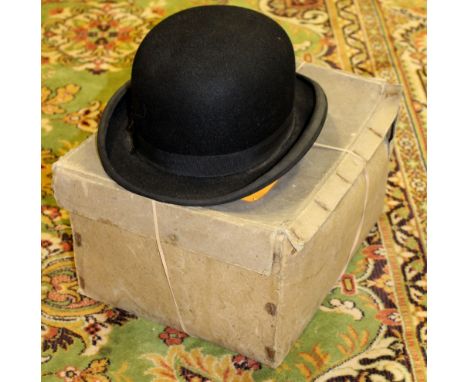 A Scotts bowler hat, early 20th Century; together with a Christys London top hat, complete with original box, with silk scarf