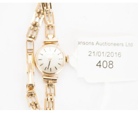 A Tissot 9ct gold cased ladies' wristwatch, the circular dial with baton numerals, open link bracelet 