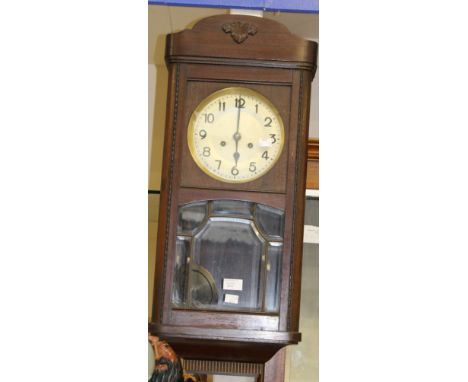 A wooden wall clock with key 1930s 