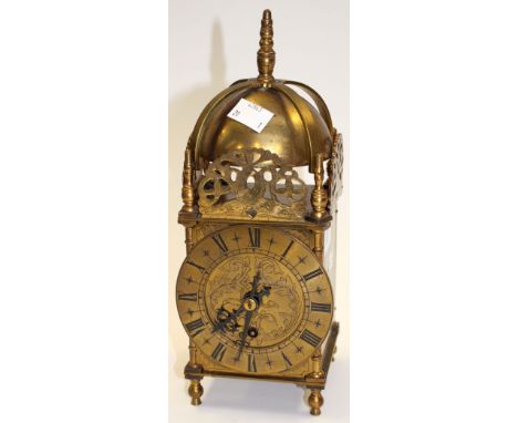 A brass lantern clock by Bennett