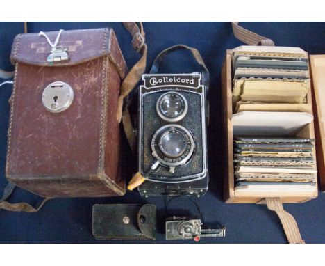 A Rolleicord 1930s vintage camera with instructions with timer, complete with case; together with a collection of lantern sli