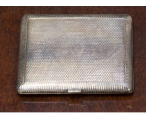 A George V silver cigarette case with engine turned outer decoration and gilt interior, hallmarked for London 1919, dimension