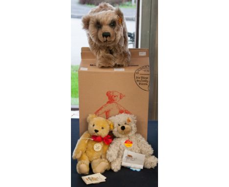 A boxed Steiff 'Grizzly' bear complete with button in ear, together with an unboxed Steiff 'Charly' and unboxed Steiff '1909 