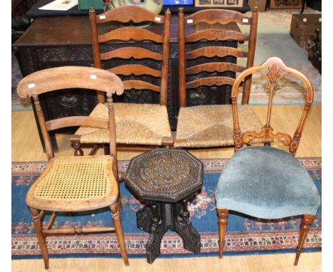 Two early 19th Century ash ladder back regional chairs with rush seats, a mid Victorian walnut parlour chair, a late Victoria