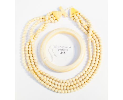 An ivory bangle and necklace of ivory beads (clasp af)