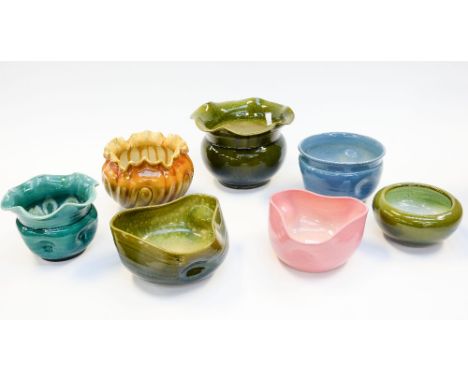 After Christopher Dresser for Ault, a collection of Bretby pottery bowls and jardinieres, some made from the original Ault mo