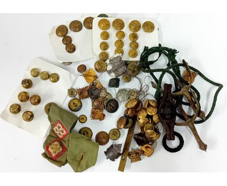 A collection of 20th Century military buttons and badges, to include both king and queens crowns, army rank pips, together wi