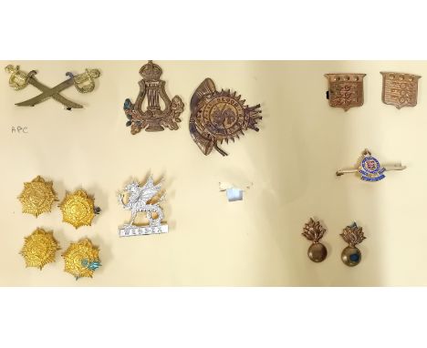 A collection of 20th century cap badges, to include a Salvation Army Blood and Fire, an APC crossed swords, Wessex, a Lyre, A