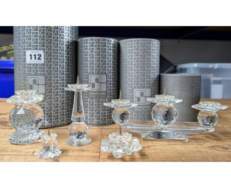 Swarovski Crystal Glass, a collection of candlestick holders, to include three Candlestick Holder, etc, four boxed, one unbox