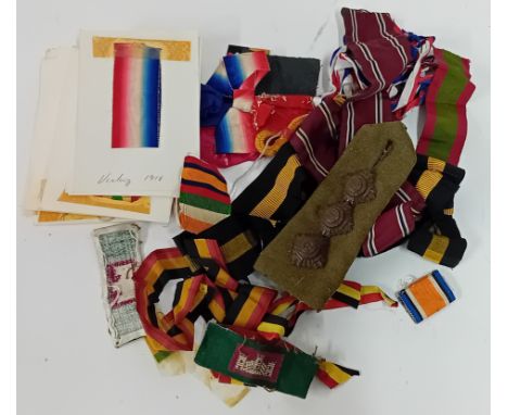 A collection of 20th century military medal ribbons and a shoulder epaulette.