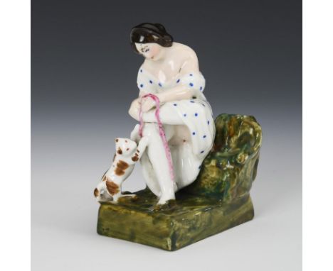 Erotische Figur: Dame mit Katze. Ungemarkt, 2. H. 19. Jh.Polychrom bemalt. H 10 cm. Auf einer Rasenbank sitzende junge Frau, 