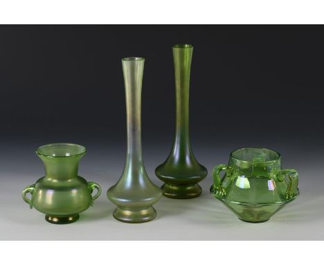 4 verschiedene Jugendstil-Vasen. Um 1900.             3x Uranglas, 1x grünes Glas, irisiert, teils mattiert. H max 25,5 cm.  