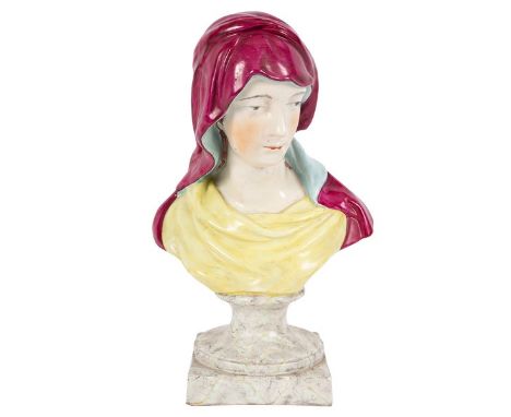 A Ralph Wood pearlware bust of the Pieta, early 19th Century, wearing a scarlet head scarf and yellow dress, on a marbled soc