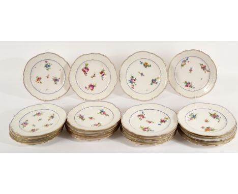 Twenty-five Sèvres plates, painted with three sprays and a sprig, within a border moulded with flower garlands at intervals, 