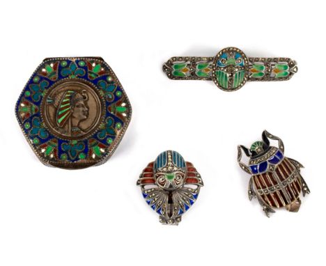 An Egyptian enamelled hexagonal box, 5cm wide, two enamel and marcasite Egyptian clips of scarab form set in silver, a simila