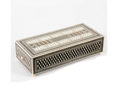 An Anglo-Indian sadeli work gaming box, the upper part with cribbage board above a drawer containing dominoes, 28.5cm long/se