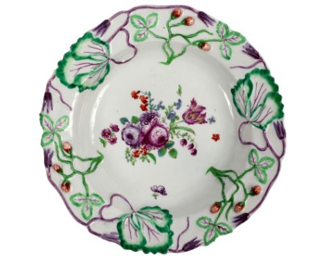 A Longton Hall strawberry deep plate, circa 1755, 24cm diameter/see illustration CONDITION REPORT: Small chip to footrim, oth