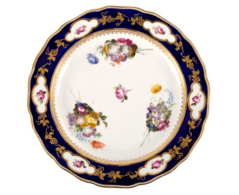 A Derby blue ground plate, circa 1790, puce marks, probably painted by William Billingsley, with loose bouquets within a bord