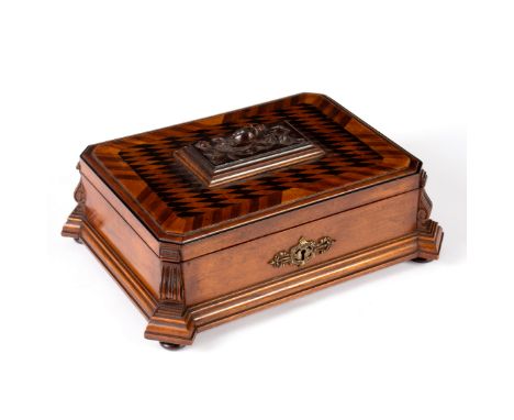 A Continental parquetry inlaid jewel box, of canted rectangular form, the lid with central carved panel of a rose, mirror ins