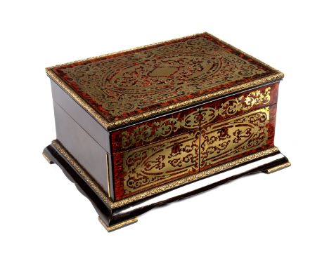 A 19th Century Boulle work dressing case, J Taulin, Palais Royal, with fitted interior (lacking fittings), hinged cover and p