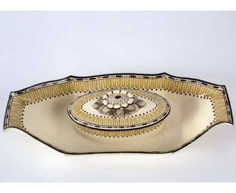 A Wedgwood creamware tub and cover, circa 1785, with integral stand, 31cm long CONDITION REPORT: There is a restored chip to 