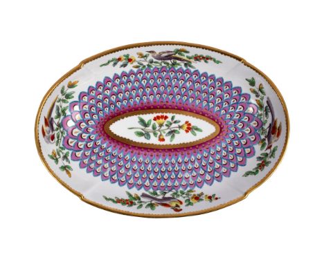 A Spode oval dish, circa 1820, decorated in Chelsea style with peacock scale ground and border of fancy birds, 26cm long/see 