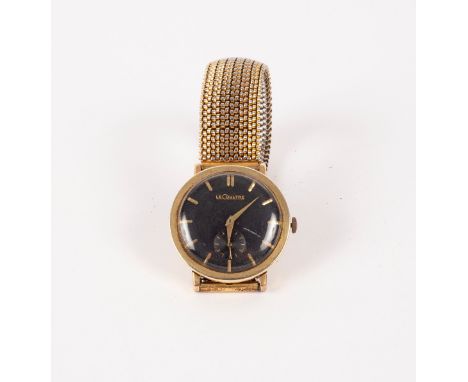 A gentleman's Jaeger-LeCoultre wristwatch, in 14k gold, the circular black dial with baton hour markers and subsidiary second